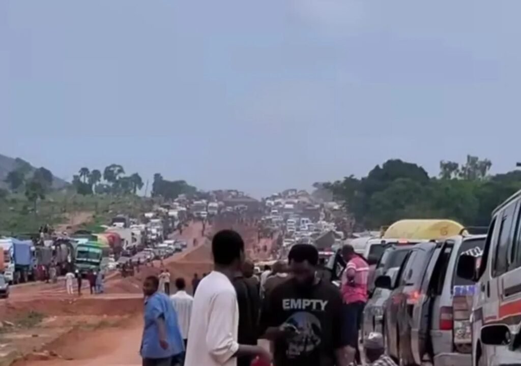 Vehicles stuck in heavy traffic on the Abuja-Kano highway amid roadworks and rainfall during Eid-el-Kabir.