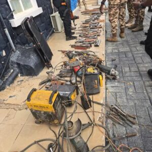 Recovered fabricated AK-47 rifles and weapon-making equipment displayed after a security raid in Plateau State.