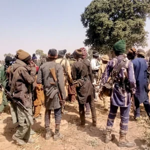 File photo depicting armed bandits as Residents gathered in rural Zamfara community setting in Maradun LGA, illustrating insecurity and rural displacement in north-west Nigeria.