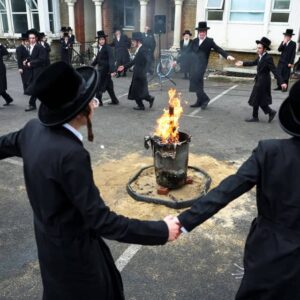 Ultra-Orthodox Jewish men celebrate Lag B’Omer with bonfires in north London under police presence