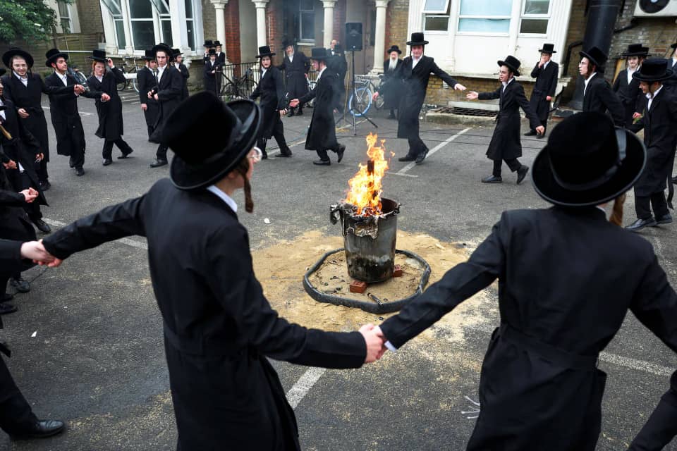 Ultra-Orthodox Jewish men celebrate Lag B’Omer with bonfires in north London under police presence