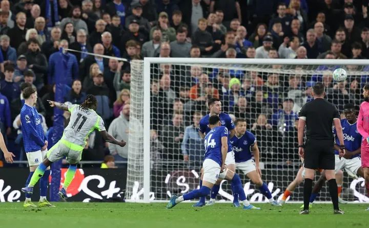 Jeremy Doku scores Man City's third goal at Everton