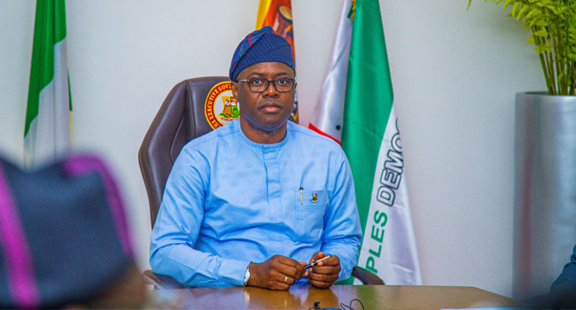 Governor Seyi Makinde signs an executive order regulating vigilante and local security groups during a security briefing in Ibadan.