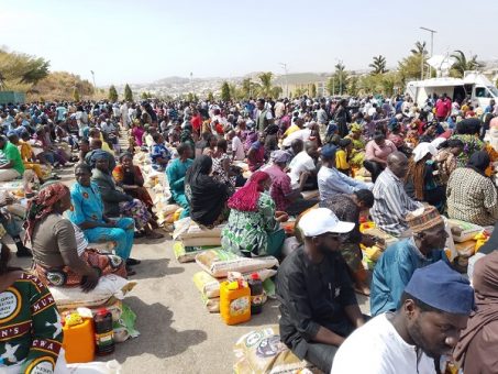 Officials distribute bags of rice, beans and relief supplies to victims of the recent attack in Bassa, Plateau State.