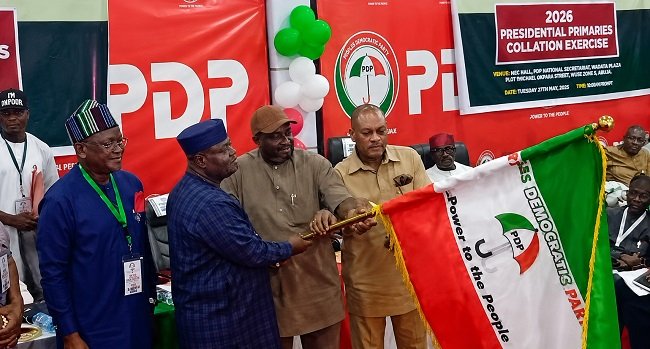Senator Sandy Onor receives PDP flag after emerging as the party’s consensus presidential candidate for the 2027 election in Abuja.