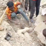 Rescue workers search through rubble after three-storey building collapse in Durumi area of Abuja
