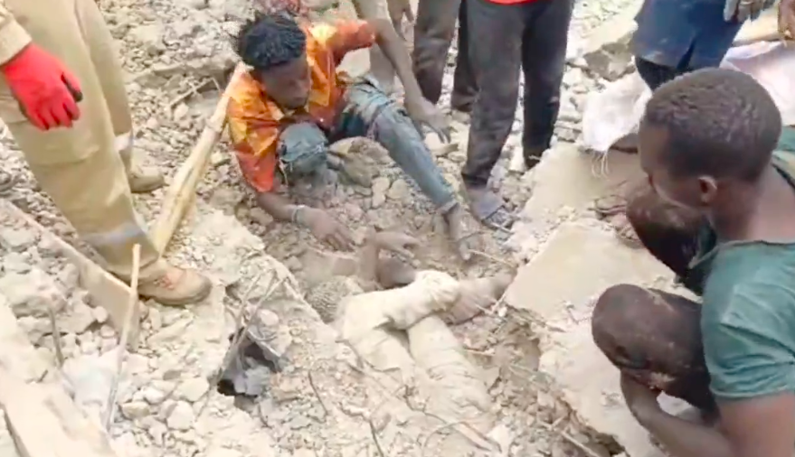 Rescue workers search through rubble after three-storey building collapse in Durumi area of Abuja