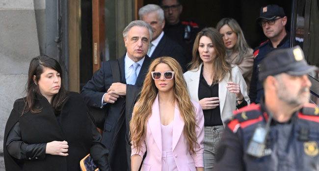 Shakira leaves court in Barcelona during earlier tax fraud proceedings in Spain.