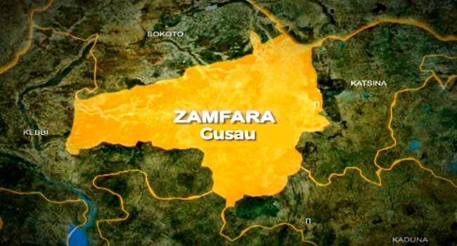 Security personnel and damaged vehicles following a terrorist ambush on travellers along the Magami-Dansadau road in Zamfara State.