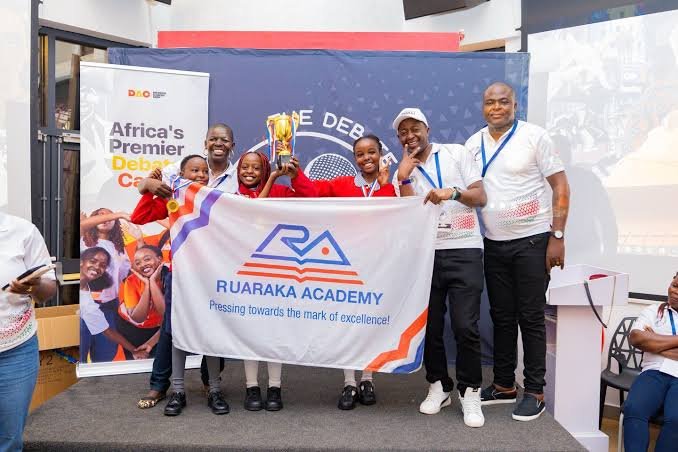 Team Nigeria debate representatives celebrating after winning the international debate championship in Rwanda.