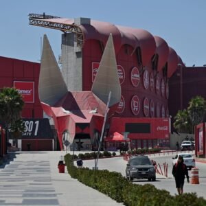 Police investigators examine a vehicle near a stadium in Tijuana, Mexico, after a body was discovered close to Iran’s World Cup training base.