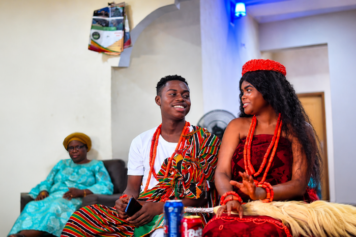 Peller and Jarvis smiling during traditional wedding ceremony while speaking in a light emotional exchange shared online.