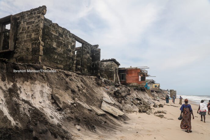 Destroyed homes and shoreline in Okun-Ajah, Lagos, after severe coastal erosion and ocean surge displaced residents.