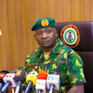 Defence Minister Christopher Musa, represented at a security summit in Abuja, announcing plans to embed journalists with military units during selected operations.