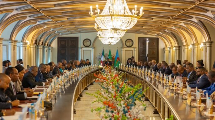 Equatorial Guinea government cabinet meeting room with officials discussing national policy and economic performance review in Malabo.