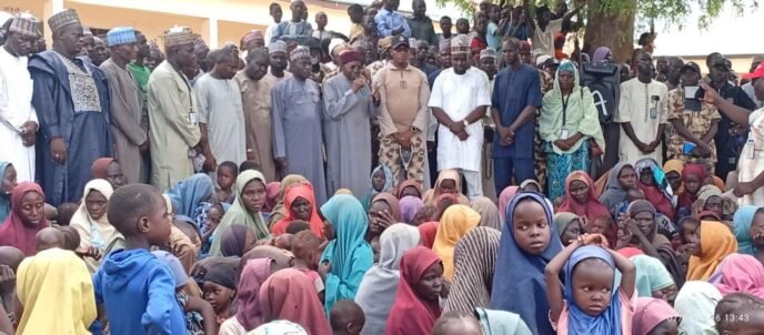 Recently rescued abductees gather with relatives and community members in Ngoshe, Borno State, after being freed from a terrorist enclave in the Mandara Mountains.