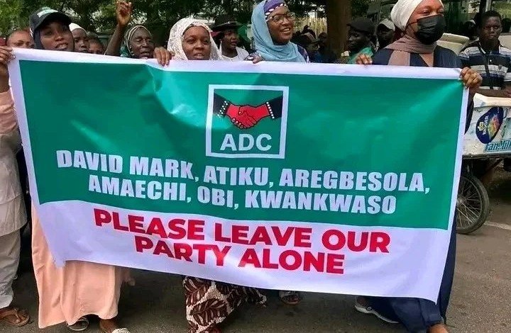 Supporters of David Mark-led ADC leadership protesting outside the Federal High Court in Abuja during the party's ongoing leadership dispute.