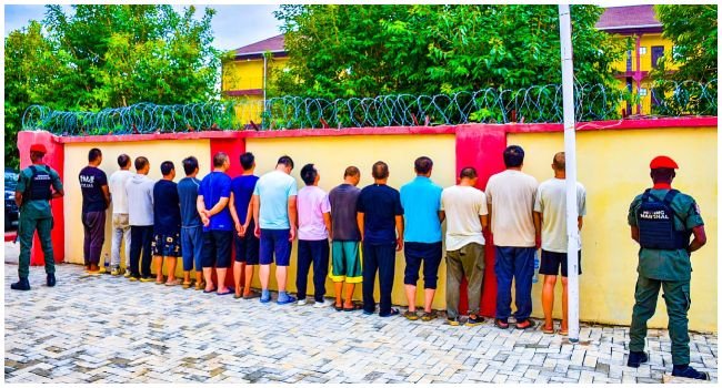 NSCDC officers present arrested suspects in an illegal lithium mining case involving Chinese nationals and Nigerians at a Federal High Court sitting in Abuja.