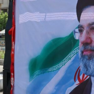 Iranian and US officials signing agreement document amid diplomatic negotiations and Middle East tensions