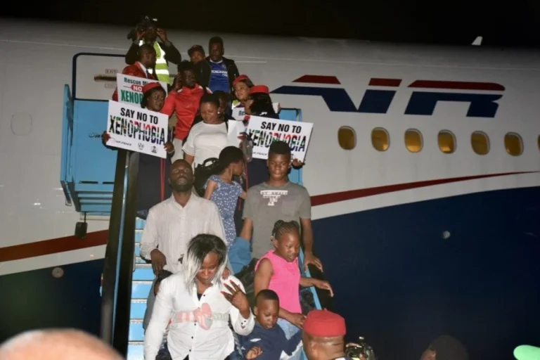 Nigerian returnees disembark from an Air Peace aircraft during a previous repatriation operation from South Africa.