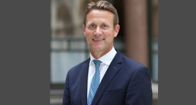 Peter Vowles, UK diplomat appointed as new British High Commissioner to Nigeria, standing in formal portrait photo.