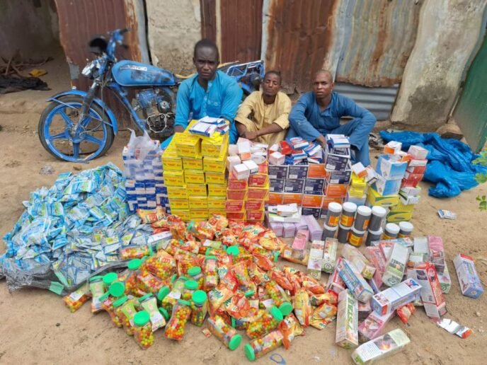 DSS operatives and forest guards conducting an anti-terrorism operation in forested areas of Borno State, Nigeria, inspecting seized medical supplies allegedly linked to ISWAP logistics networks.