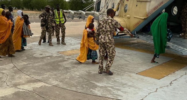 Rescued women and children receive assistance after being freed from an ISWAP enclave during Operation Hadin Kai operations in Borno State.
