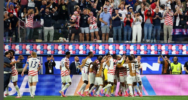USA midfielder Giovanni Reyna celebrates with teammates after scoring during the FIFA World Cup 2026 group-stage match against Paraguay in Los Angeles.