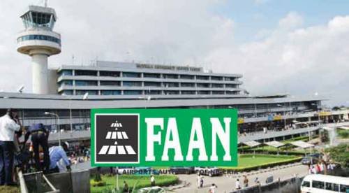 FAAN signage at Nigerian airport terminal with taxis lined up outside awaiting passengers and regulatory updates.