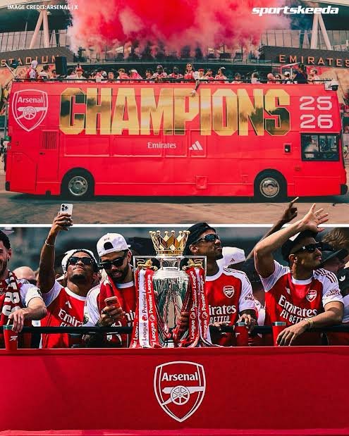 Arsenal players and manager Mikel Arteta celebrate with the Premier League trophy during an open-top bus parade through north London as thousands of fans line the streets.