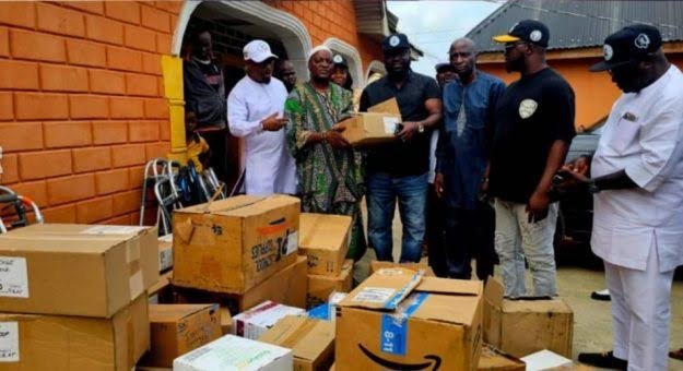 City Boy Movement officials donating medical supplies and cash to Esiele community in Oyo State after school abduction incident.