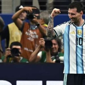 Lionel Messi celebrates after scoring during Argentina's 2-0 World Cup victory over Austria in Arlington, Texas, becoming the tournament's all-time leading goalscorer.