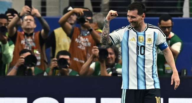 Lionel Messi celebrates after scoring during Argentina's 2-0 World Cup victory over Austria in Arlington, Texas, becoming the tournament's all-time leading goalscorer.