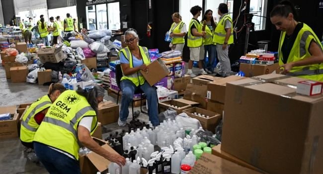 Volunteers prepare humanitarian aid while the United States deploys warships, aircraft and rescue teams following the deadly Venezuela earthquakes.