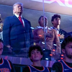 US President Donald Trump attending Game Three of the NBA Finals at Madison Square Garden in New York, seated in an executive suite alongside officials and guests during the match between the San Antonio Spurs and New York Knicks.