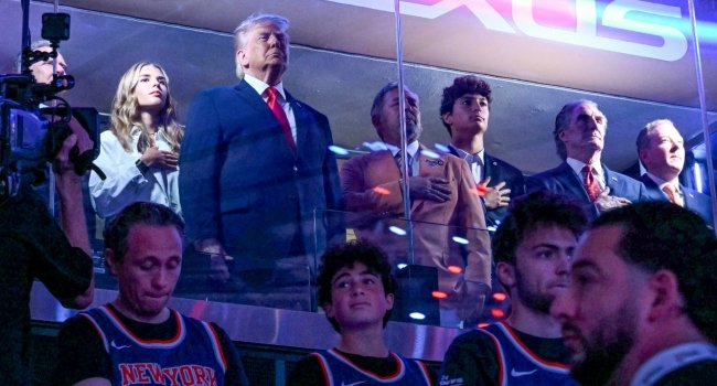 US President Donald Trump attending Game Three of the NBA Finals at Madison Square Garden in New York, seated in an executive suite alongside officials and guests during the match between the San Antonio Spurs and New York Knicks.
