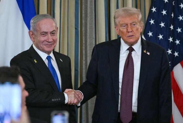 Israeli Prime Minister Benjamin Netanyahu shakes hands with US President Donald Trump ahead of White House talks on the Iran war and Middle East security.