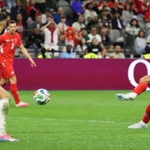 Switzerland players celebrate after scoring during their 2-0 World Cup victory over Algeria in Vancouver.