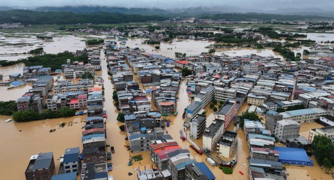 Rescue teams respond after deadly storms and flooding caused widespread destruction in central and southern China.