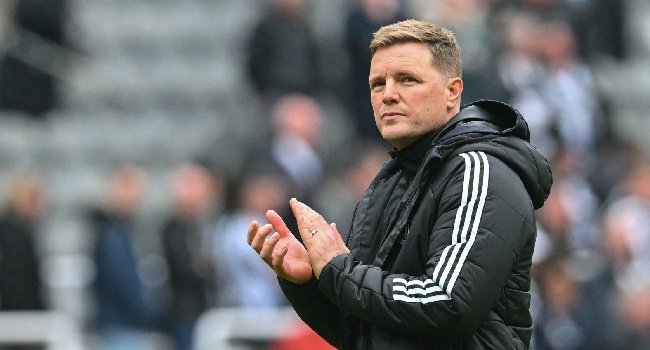 Eddie Howe applauds Newcastle United supporters after a Premier League match at St James' Park.
