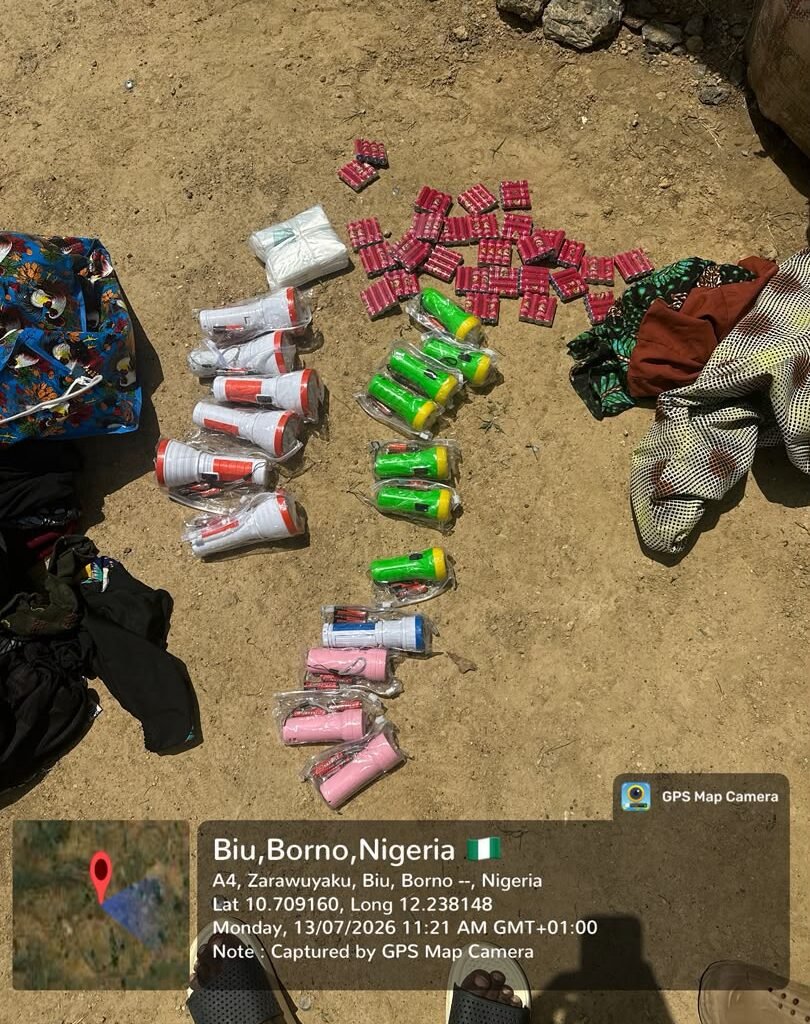 Troops display torchlights and batteries allegedly recovered from a pregnant woman arrested during a security checkpoint operation in Borno State.