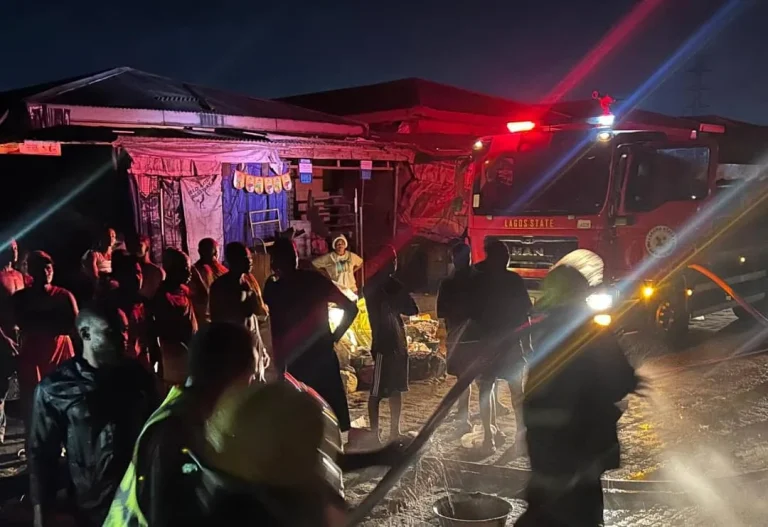 Firefighters respond to a fire outbreak that destroyed 17 shops at Sabo Market in Ikorodu, Lagos State, after a suspected electrical surge.