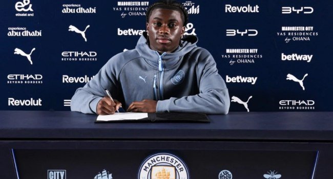 Jeremy Monga poses after signing for Manchester City following his transfer from Leicester City on a five-year contract.