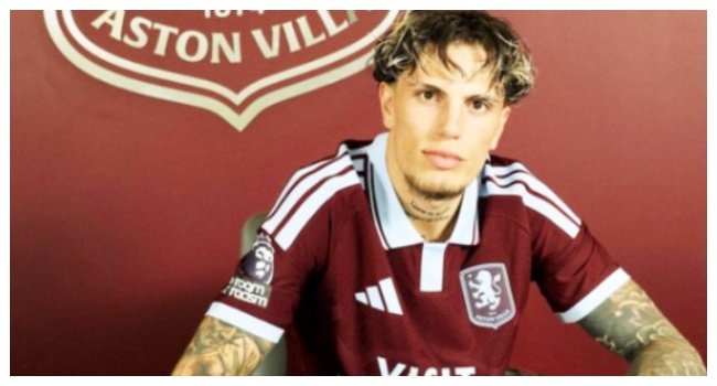 Alejandro Garnacho poses in an Aston Villa home shirt after completing his season-long loan move from Chelsea to Villa Park.