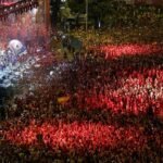 Spain's World Cup-winning players celebrate with the trophy during a victory parade at Cibeles Square in Madrid after defeating Argentina in the 2026 FIFA World Cup final.