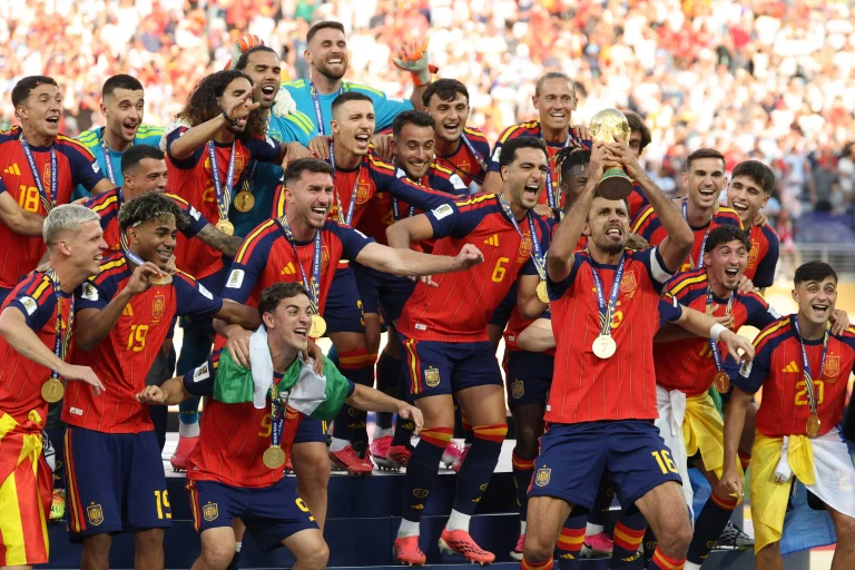 Spain players celebrate with the FIFA World Cup trophy after defeating Argentina 1-0 in the 2026 World Cup final.