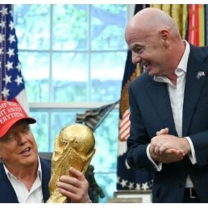 FIFA President Gianni Infantino with US President Donald Trump and the FIFA World Cup trophy before the 2026 World Cup final.