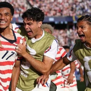 Folarin Balogun celebrates after scoring for the United States men's national soccer team during their 2-0 World Cup victory over Bosnia and Herzegovina national football team.