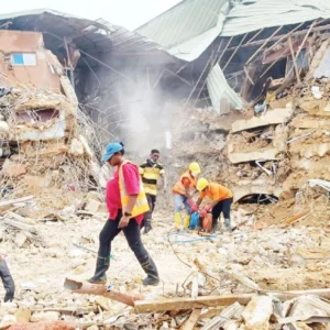 Collapsed Elite Five Star Lodge hostel near Federal Polytechnic Oko as emergency responders conduct rescue operations in Anambra State.