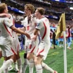 Harry Kane celebrates with England teammates after scoring during England’s 2-1 comeback victory over DR Congo in the 2026 FIFA World Cup Round of 32 in Atlanta.